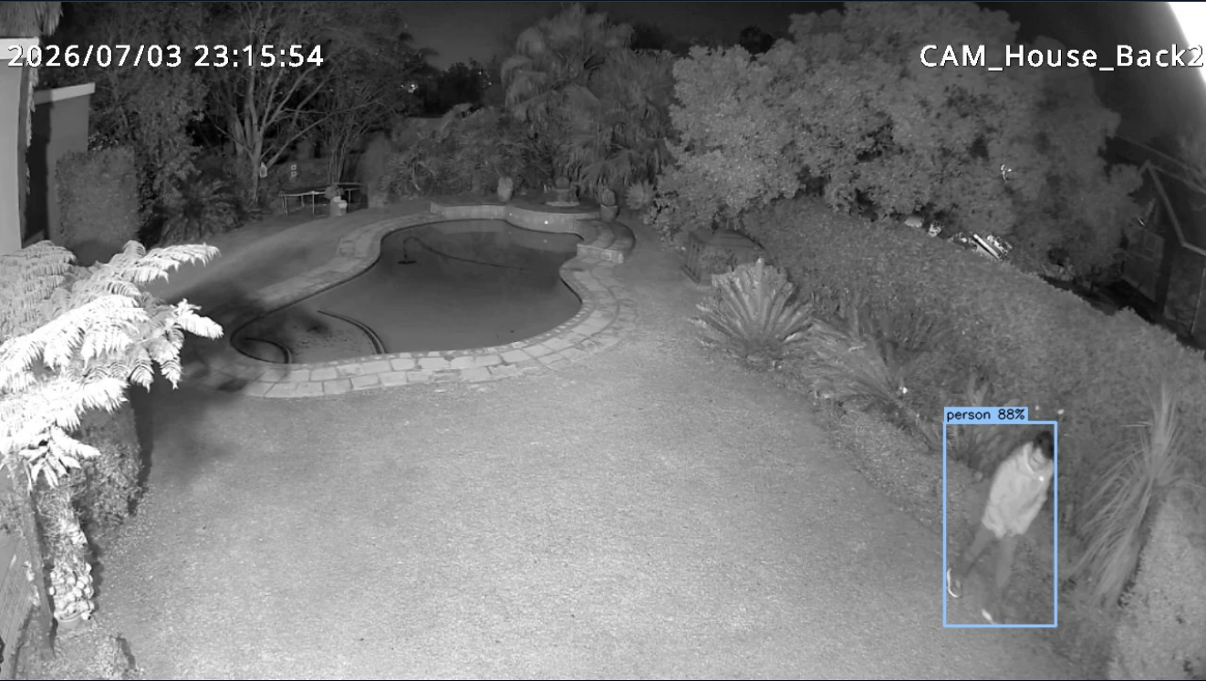 AI detects a person in the back yard at night — infrared night vision with bounding box and confidence score